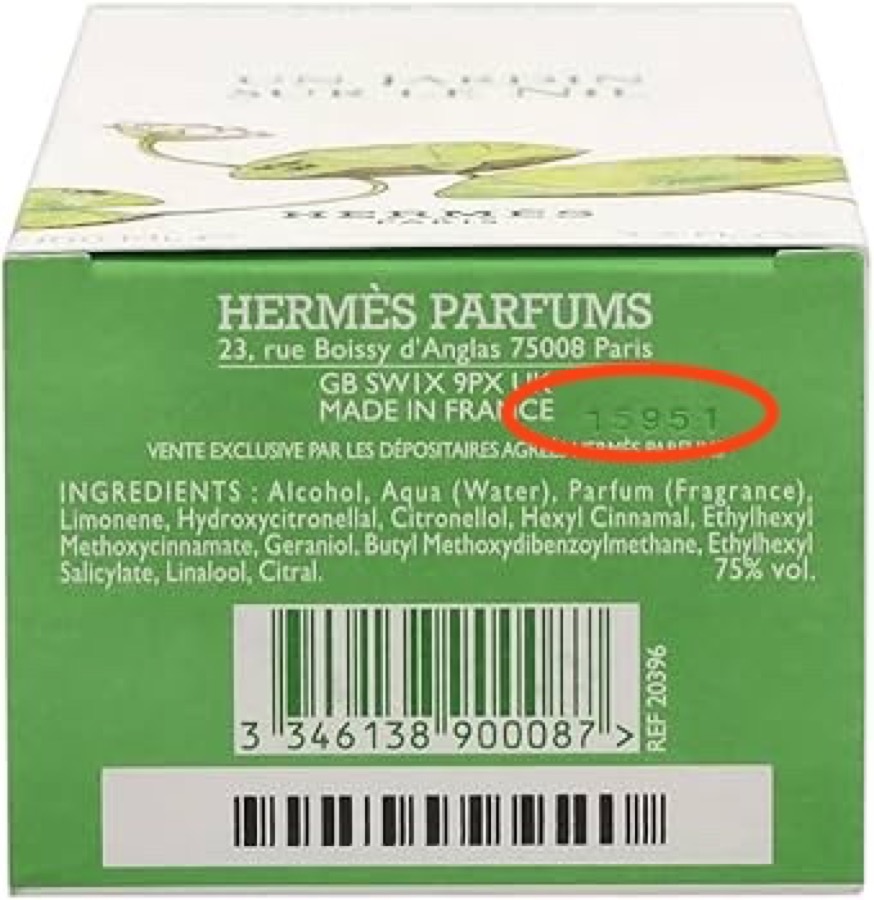 Batch code circled on the side panel of a perfume box, next to the made-in line